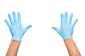 Two doctors hands in blue gloves