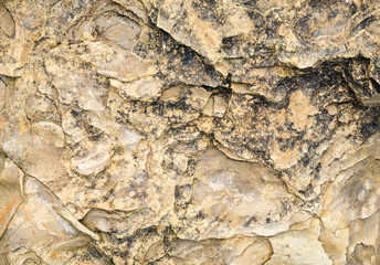 Laminated rocky surface from the riverbed of the mountain river