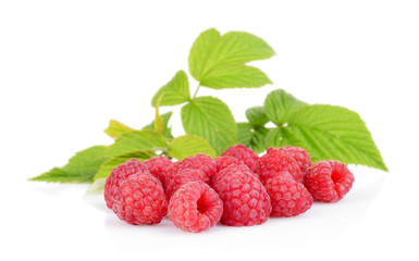 Few raspberries with leaves isolated on white