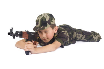 Fototapeta premium Young boy hold gun isolated on white background