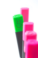 marker with a smile differs from others in the same row