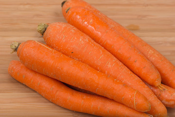 Fresh carrot on a wooden table
