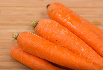 Fresh carrot on a wooden table