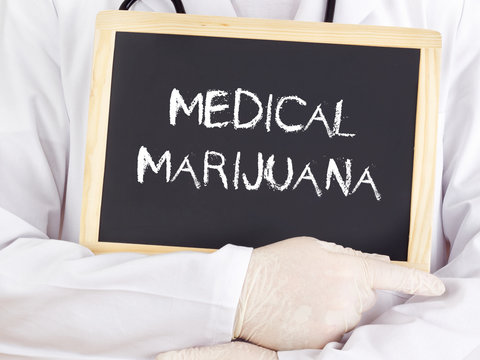 Doctor Shows Information On Blackboard: Medical Marijuana