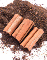 Cinnamon stick on dried and processed tea leaves