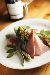 Ham  Meat and vegetables arranged on a plate