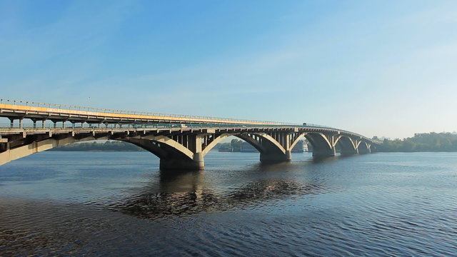 lots of metro trains on bridge ride over Dnipro river, timelapse