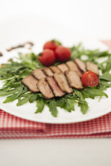Cut Meat Steak on Arugula Salad