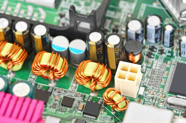 Printed computer motherboard with microcircuit, close up, DOF