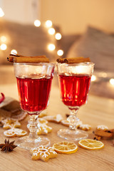 Two glasses of mulled wine with orange and spices