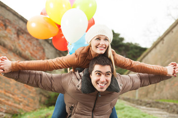 Happy couple having fun outdoors on a winter day