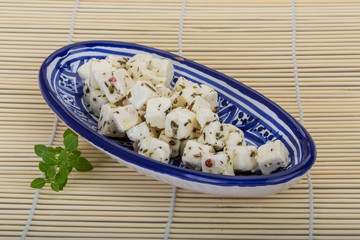Cheese with spices and oil
