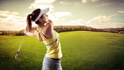 Woman practising golf exercise over beautiful landscape