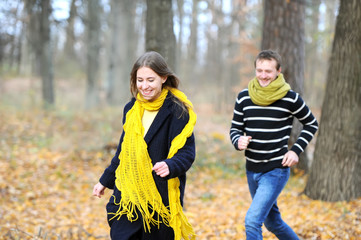 Pair of loving hearts walk in the autumn park