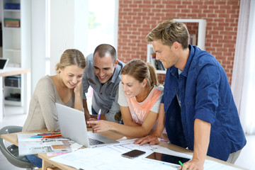 Fototapeta premium Group of students working on construction project