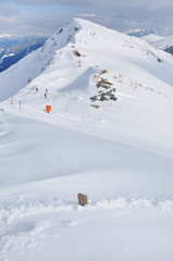 Fototapeta na wymiar Skiers skiing on piste