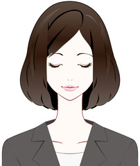 スーツの女性　目を閉じる