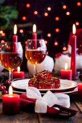 Christmas gift in dishware at the table