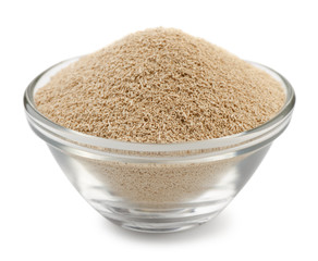 Dry yeast granules in glass bowl