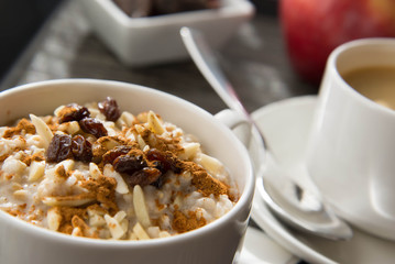 coffee and oatmeal with dried fruit  healthy breakfast setting