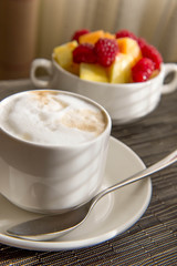 Fresh fruit and oatmeal with healthy toppings for breakfast