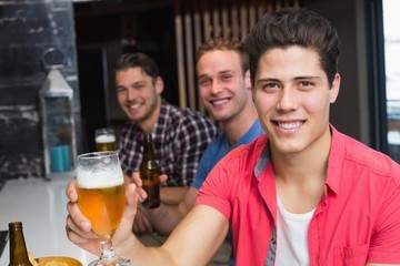 Young men drinking beer together