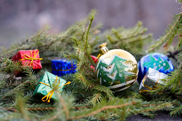 Christmas balls and toys on spruce branch