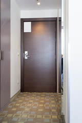 Wooden door in modern hotel apartment