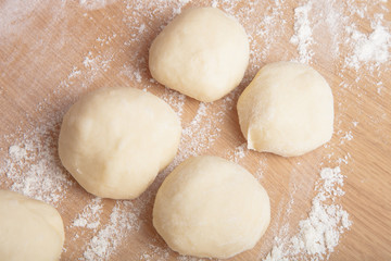 Small balls of dough with flour for pizza or cakes and scones. S