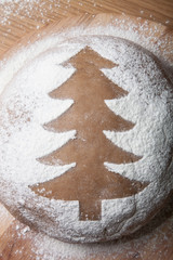 Christmas tree drawn with flour on the dough
