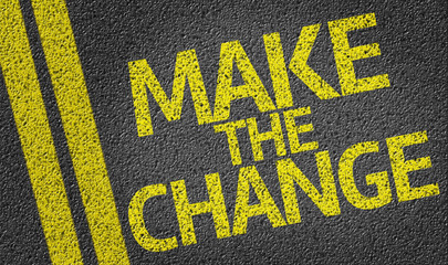 Make the Change written on the road