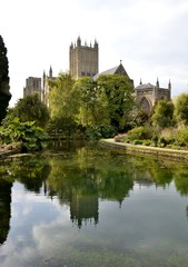 Fototapeta na wymiar Wells cathedral and water reflections
