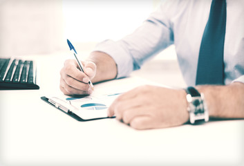 businessman working and signing papers