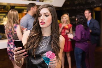 Pretty brunette sending a text