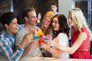 Young friends having a drink together