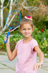 Cute girl with racket Outdoors