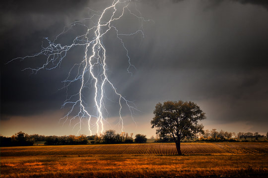 Lightning over field © Black Ivy Images