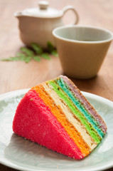 Obraz na płótnie Canvas Delicious rainbow cake on plate on table