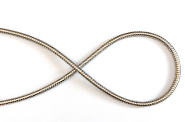 elegant curve formed by a flexible metal hose