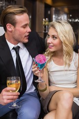 Happy couple having a drink together
