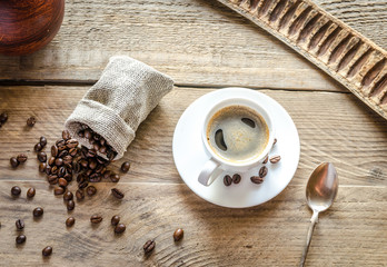 Cup of coffee with coffee beans