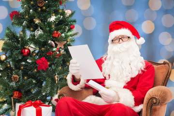 man in costume of santa claus with letter