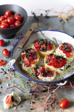mediterranean bruschetta with cherry tomatoes, olive and thyme