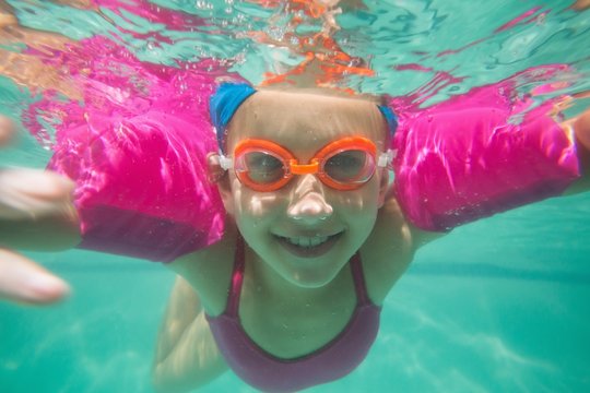 Cute Kid Posing Underwater In Pool