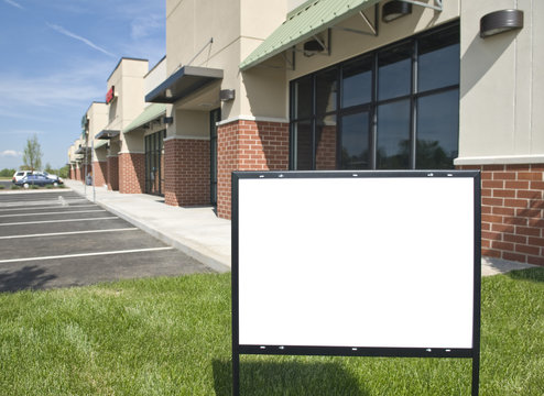 Blank Sign In Front Of New Retail Strip Center