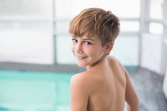 Cute little boy standing poolside - Powered by Adobe