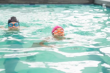 Cute swimming class in the pool