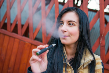 Woman smoking with electronic cigarette