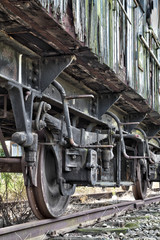 Fototapeta na wymiar Rusty wheels of abandoned train