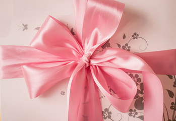 pink satin gift bow. Ribbon. Isolated on white